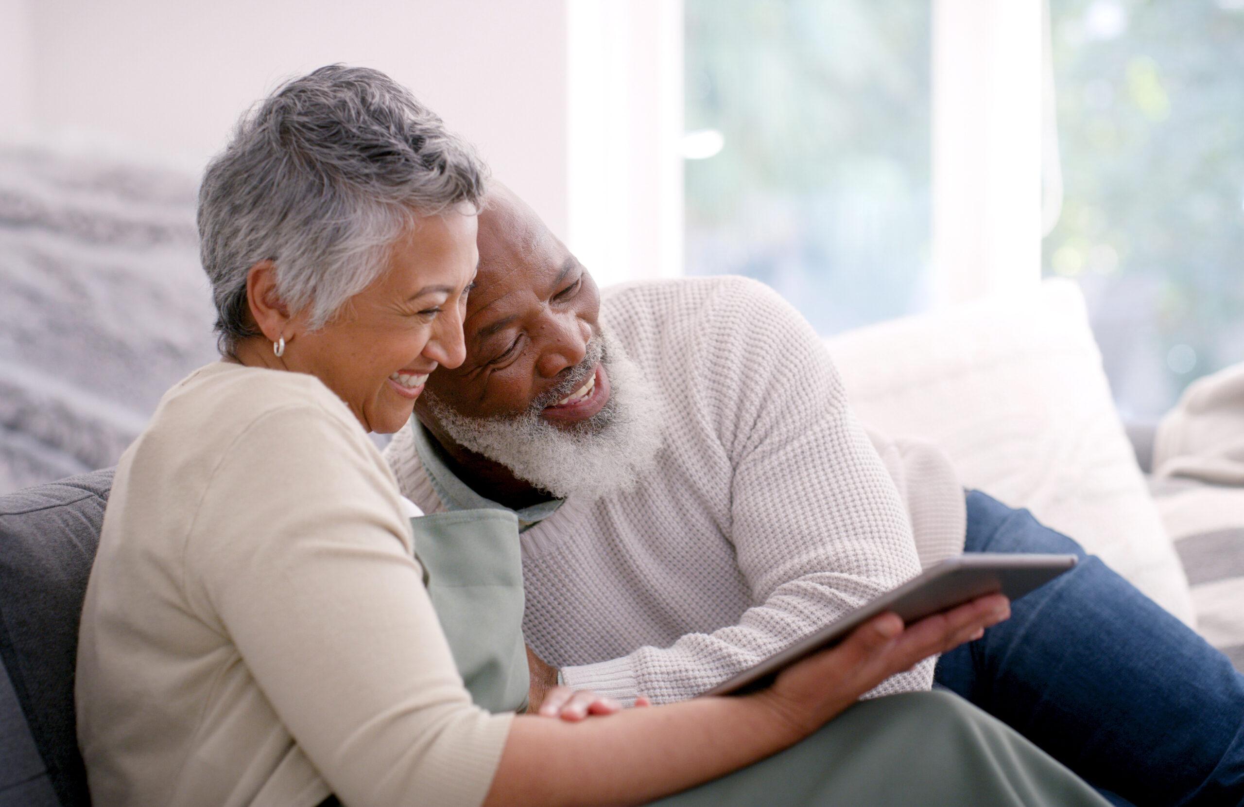 Senior couple, laughing or tablet on house sofa on movie streaming app